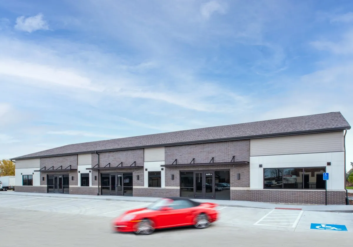 Exterior of 2200 NW 152nd Street with a red sports car, Clive, Iowa