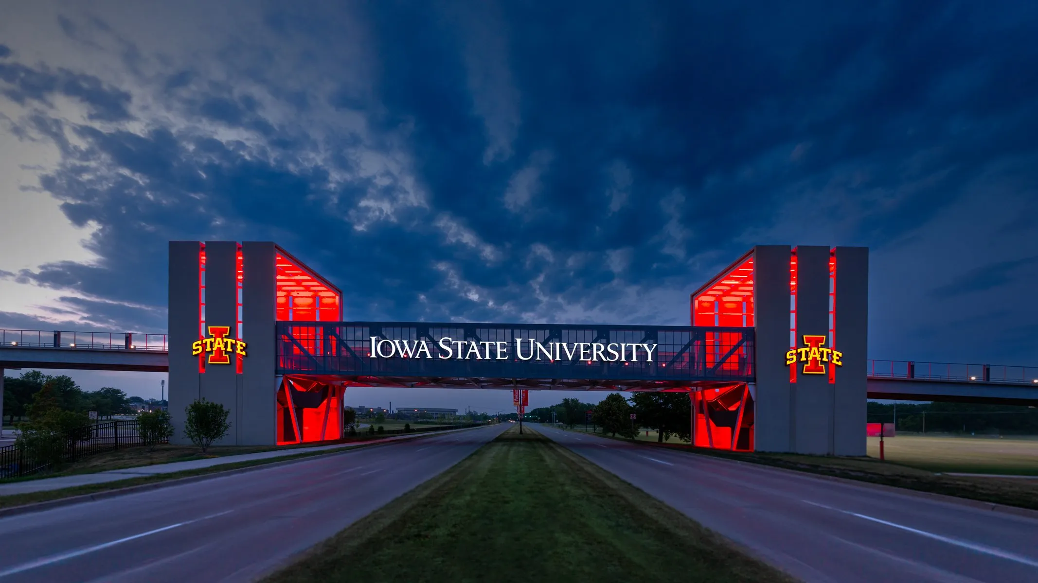 Iowa State University Gateway Bridge glowing red at dusk, Ames, Iowa