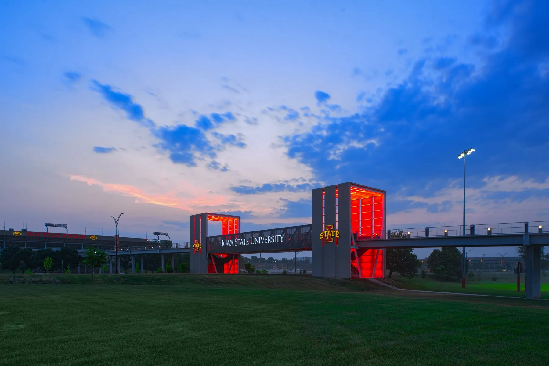 Iowa State University Gateway Bridge glowing red at dusk, Ames, Iowa