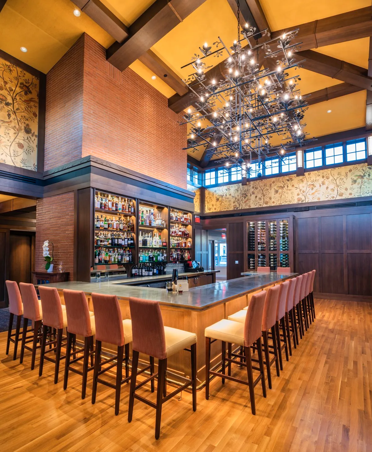 Oak Park bar with warm wood and statement lighting