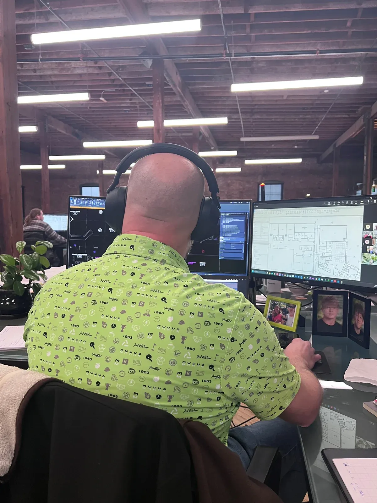 Tony at his desk at MODUS wearing the finished lime culture polo